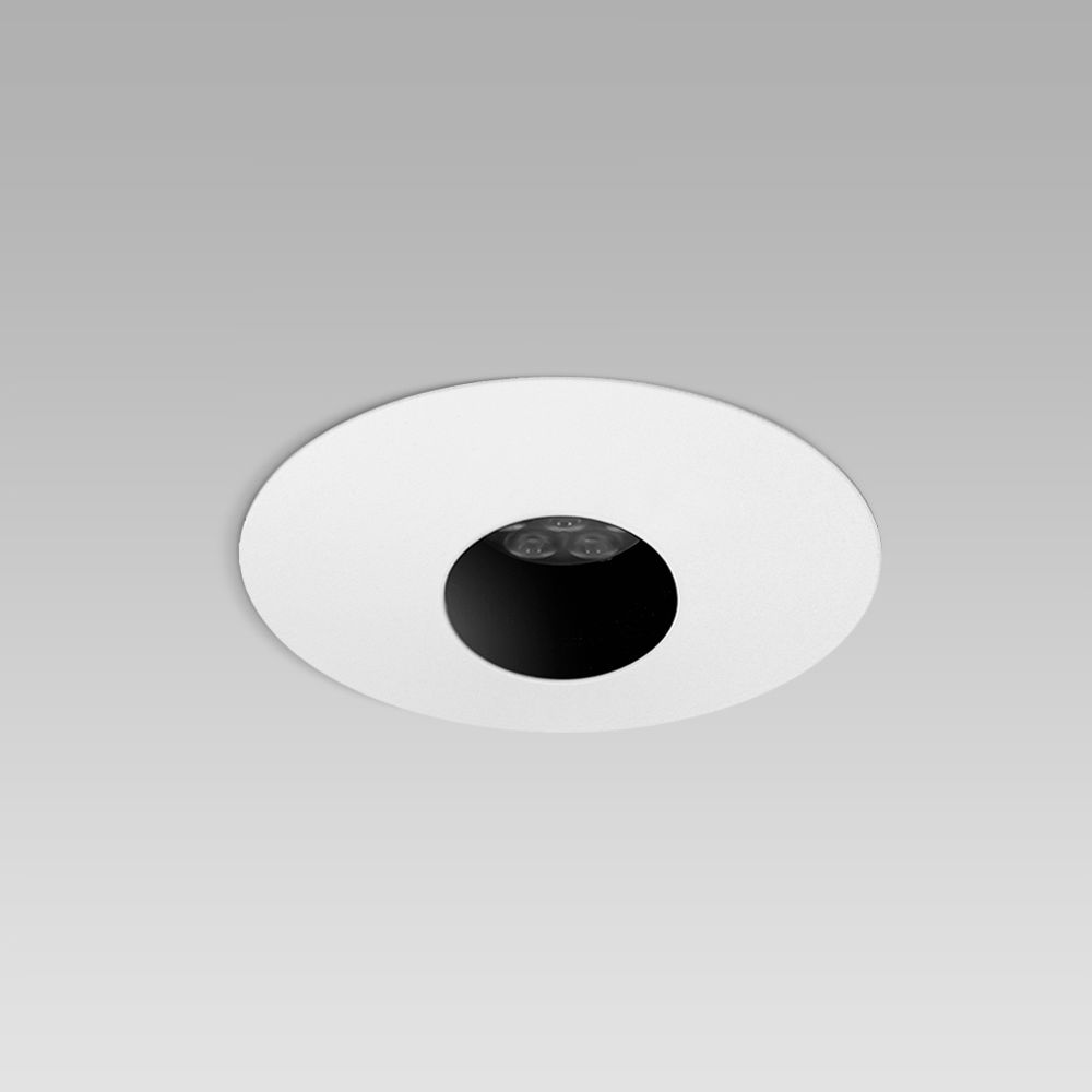 Recessed ceiling downlight for interior lighting with asymmetric pinhole optic
