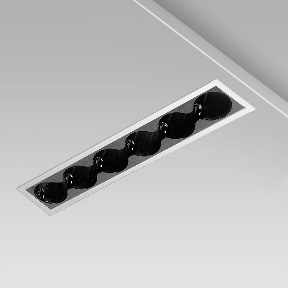 ceiling recessed linear luminaire for interior lighting design: elegant and minimalist, with protruding frame and black round glare free optic